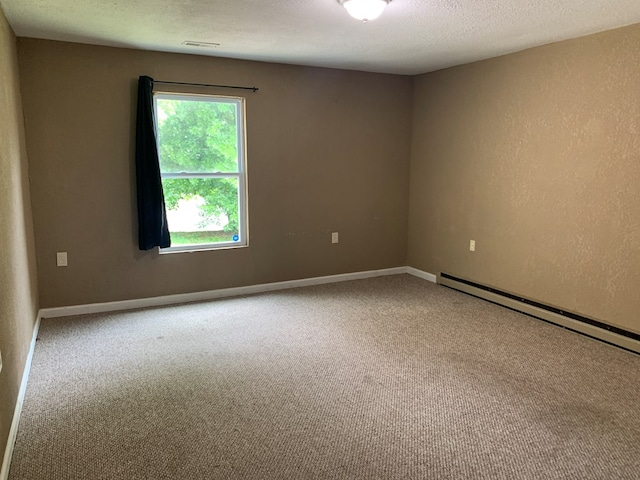 615 N Elson St, Kirksville, MO 63501 - empty room featuring carpet flooring and baseboard heating