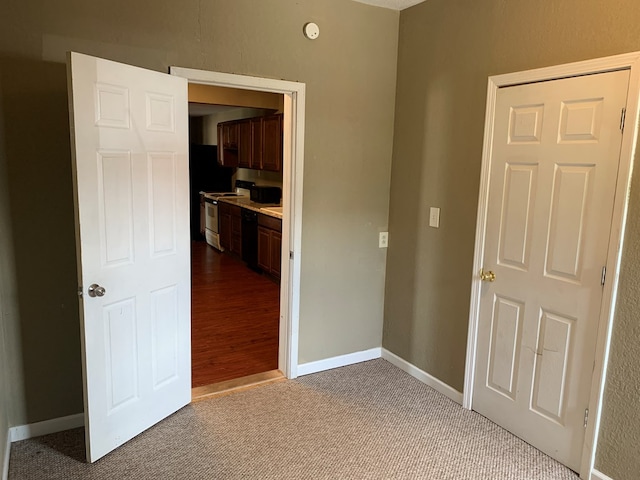 615 N Elson St, Kirksville, MO 63501 - hall featuring carpet and baseboards