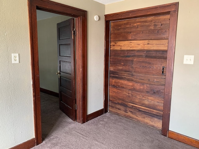 615 N Elson St, Kirksville, MO 63501 - corridor featuring carpet flooring and baseboards