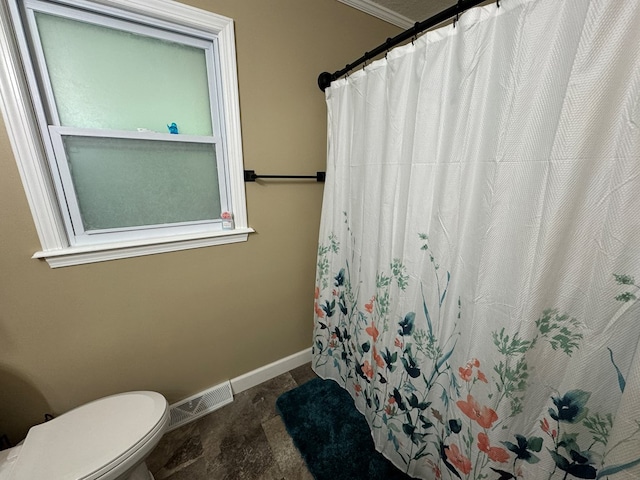 72 Manor Crest Dr, Kirksville, MO 63501 - bathroom with baseboards, toilet, and a shower with shower curtain