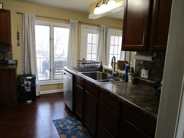 kitchen with dark hardwood / wood-style flooring, tasteful backsplash, dark brown cabinetry, sink, and dishwasher