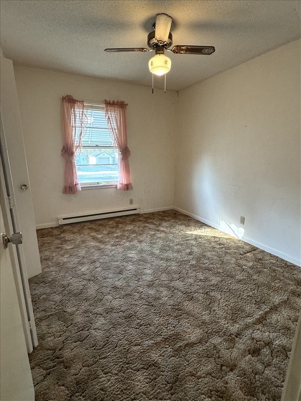 spare room with baseboard heating, ceiling fan, carpet floors, and a textured ceiling