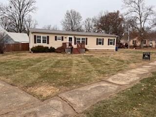 single story home featuring a front yard