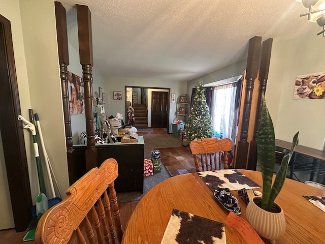 dining area with a textured ceiling