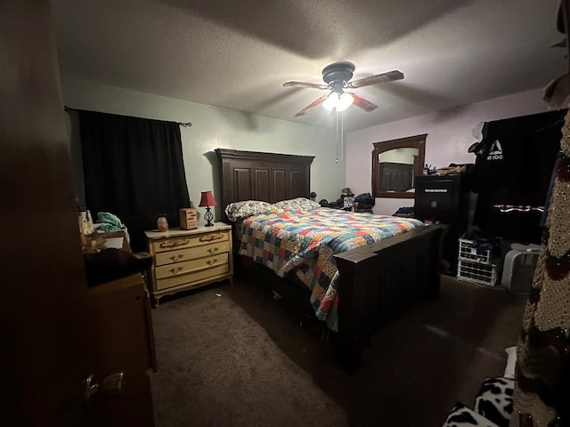 carpeted bedroom with a textured ceiling and ceiling fan