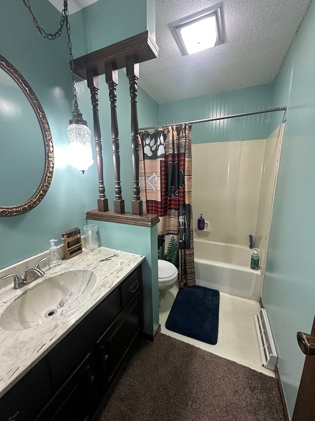 full bathroom featuring vanity, toilet, shower / bath combo with shower curtain, and a textured ceiling