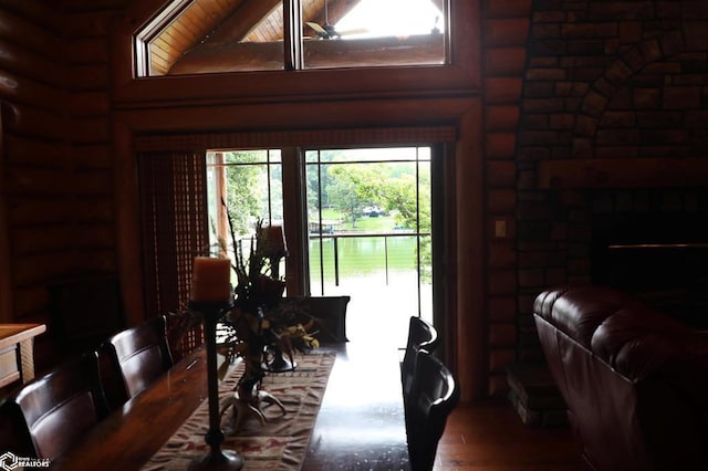 dining room with a water view and wood finished floors