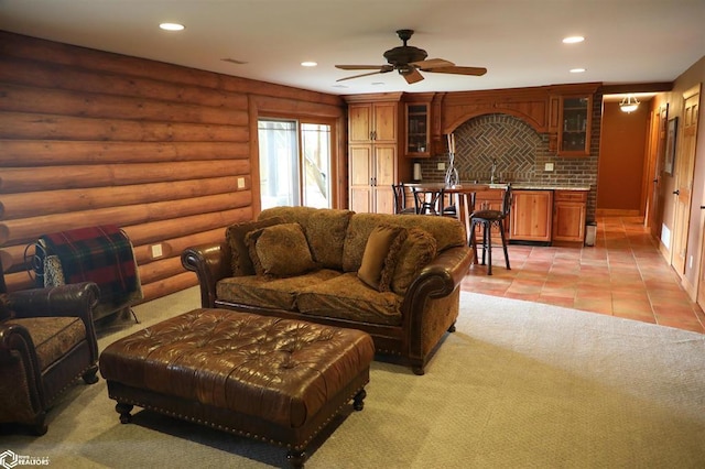 living room featuring a ceiling fan, light tile patterned flooring, log walls, and recessed lighting