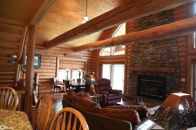 living room with wooden ceiling, dark wood finished floors, beamed ceiling, and a stone fireplace