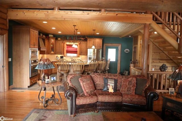 living room featuring wood ceiling, stairway, light wood-style flooring, and recessed lighting