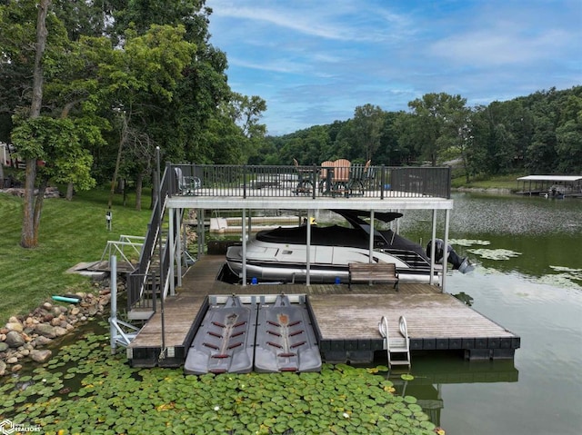 dock area with a water view and boat lift