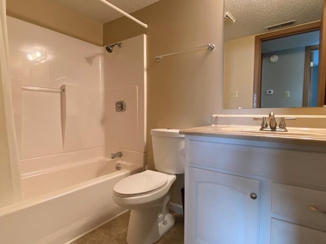 2803 Woodwinds Ct, Kirksville, MO 63501 - full bathroom with shower / washtub combination, visible vents, toilet, a textured ceiling, and vanity