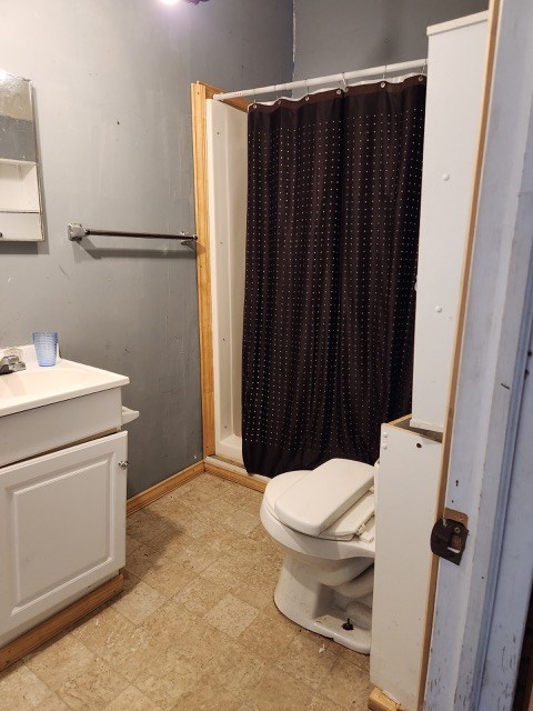605 High St, Linneus, MO 64653 - full bath featuring vanity, tile patterned floors, and a shower stall