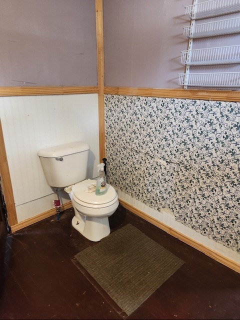 605 High St, Linneus, MO 64653 - bathroom featuring toilet and wood finished floors