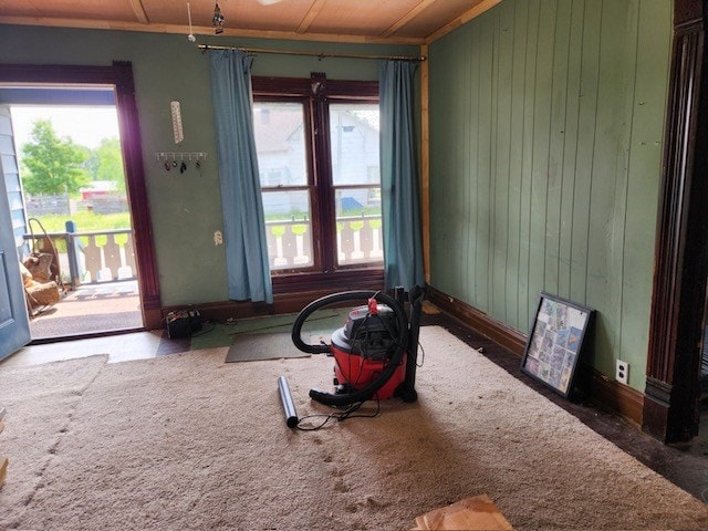 605 High St, Linneus, MO 64653 - interior space featuring healthy amount of natural light and wood walls