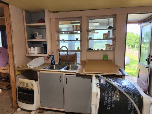 605 High St, Linneus, MO 64653 - kitchen featuring heating unit, light countertops, and open shelves