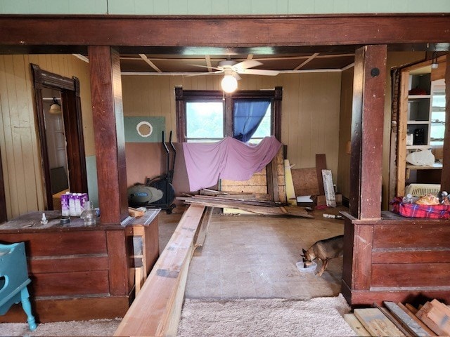 605 High St, Linneus, MO 64653 - living area with wood walls, a ceiling fan, and beam ceiling