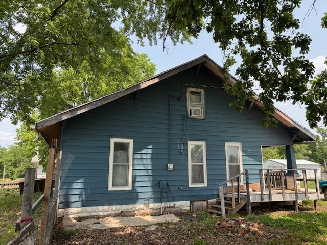 605 High St, Linneus, MO 64653 - rear view of house featuring a deck