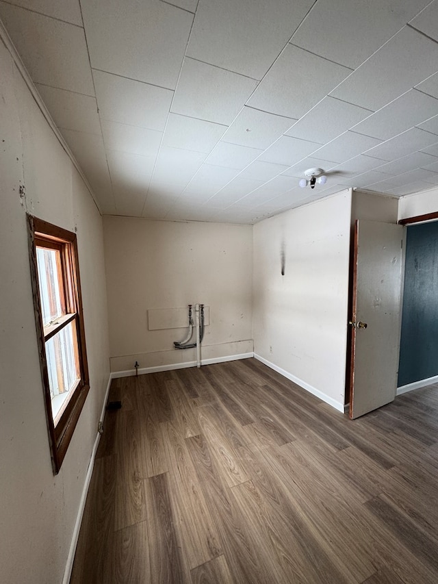 unfurnished room with hardwood / wood-style flooring