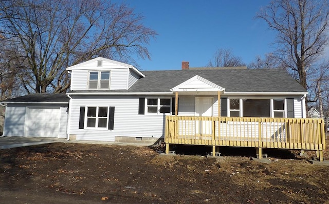 view of front of property with a deck and a garage