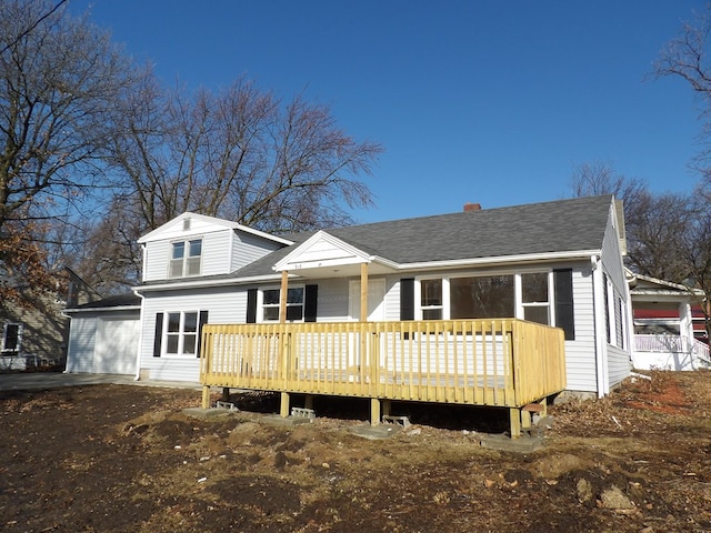 back of property featuring a deck