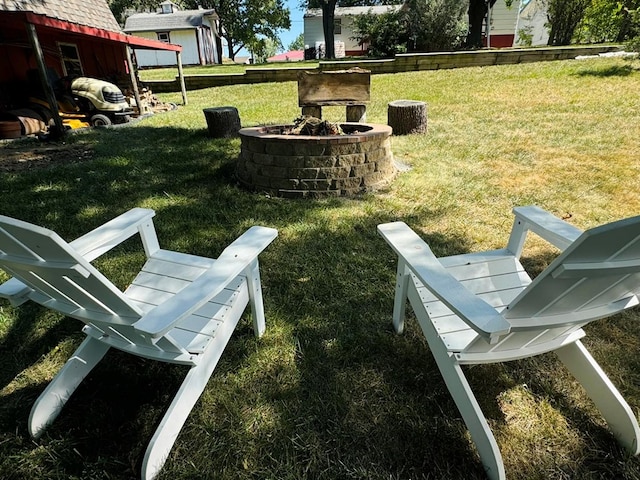 view of yard featuring an outdoor fire pit