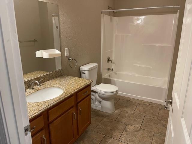 full bathroom with shower / washtub combination, vanity, and toilet