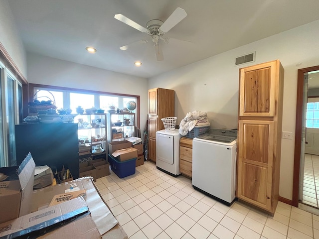 laundry area with ceiling fan, light tile patterned flooring, cabinets, and independent washer and dryer