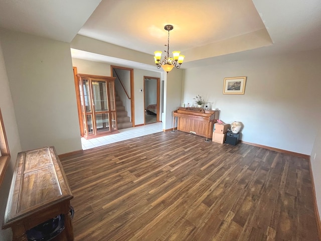 dining area with a chandelier and dark hardwood / wood-style floors