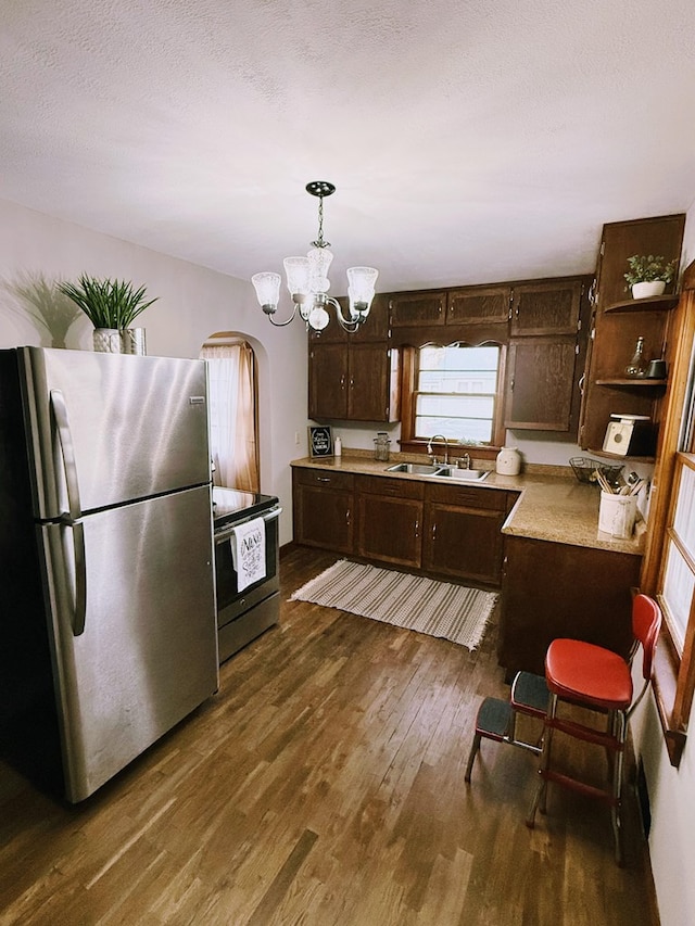 1316 Porter, Kirksville, MO 63501 - kitchen featuring a sink, dark brown cabinets, appliances with stainless steel finishes, light countertops, and dark wood finished floors