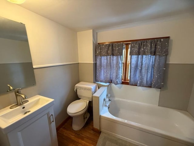 1316 Porter, Kirksville, MO 63501 - full bath with toilet, vanity, a bath, and wood finished floors