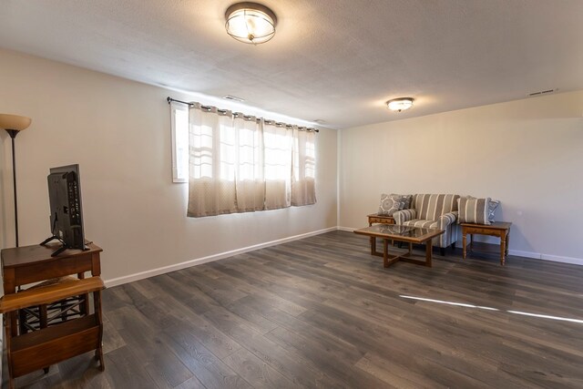 500 W Santa Fe St, Marceline, MO 64658 - sitting room featuring a textured ceiling and dark hardwood / wood-style floors