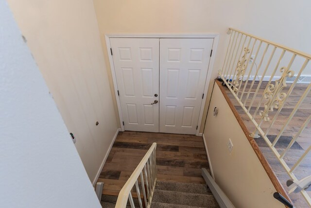 500 W Santa Fe St, Marceline, MO 64658 - stairway with wood-type flooring