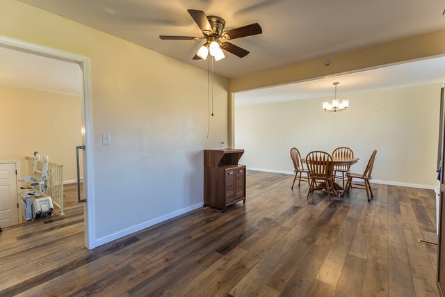 500 W Santa Fe St, Marceline, MO 64658 - dining area featuring ceiling fan with notable chandelier and dark hardwood / wood-style flooring