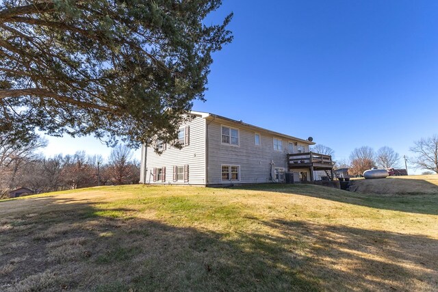 500 W Santa Fe St, Marceline, MO 64658 - back of property with a lawn and a deck