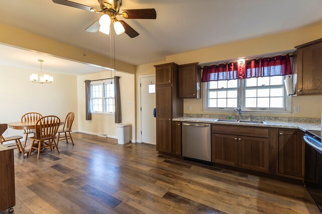 500 W Santa Fe St, Marceline, MO 64658 - kitchen featuring light stone countertops, ceiling fan with notable chandelier, sink, dishwasher, and range