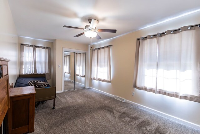 500 W Santa Fe St, Marceline, MO 64658 - interior space with ceiling fan and dark carpet