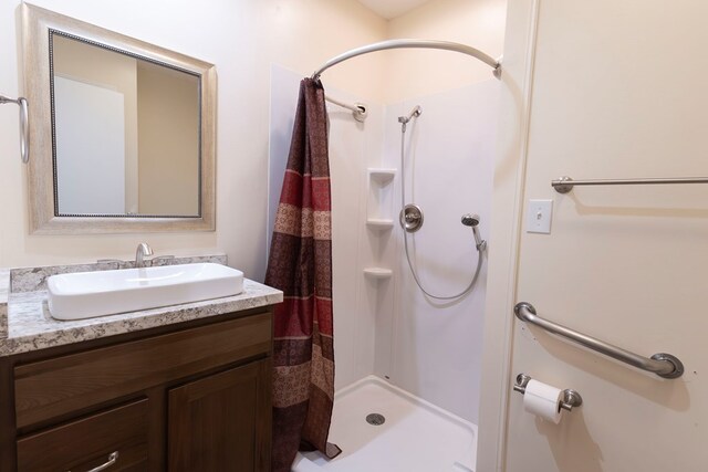 500 W Santa Fe St, Marceline, MO 64658 - bathroom with vanity and curtained shower