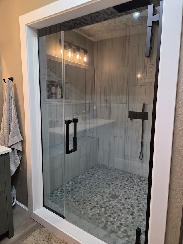 1701 Boyd, Chillicothe, MO 64601 - full bathroom featuring a shower stall, vanity, and wood finished floors
