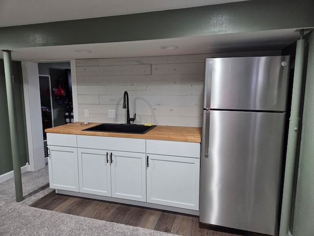 1701 Boyd, Chillicothe, MO 64601 - kitchen with freestanding refrigerator, butcher block countertops, and white cabinetry
