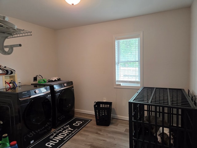 1701 Boyd, Chillicothe, MO 64601 - laundry area featuring washing machine and clothes dryer and wood finished floors