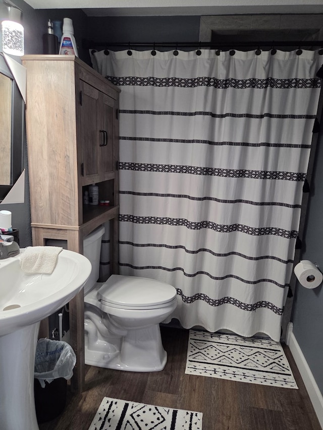 1701 Boyd, Chillicothe, MO 64601 - bathroom featuring wood finished floors and a shower with shower curtain
