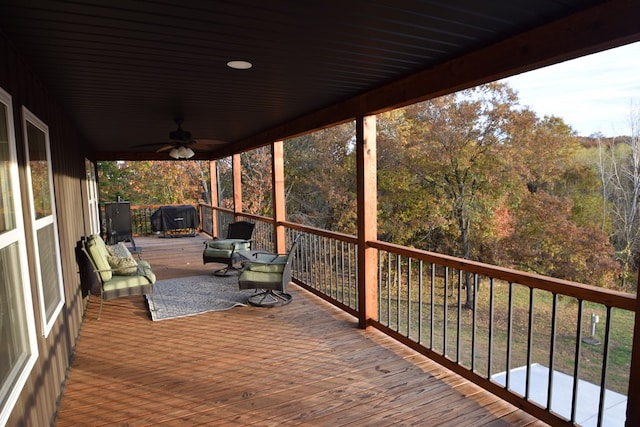 wooden deck with ceiling fan