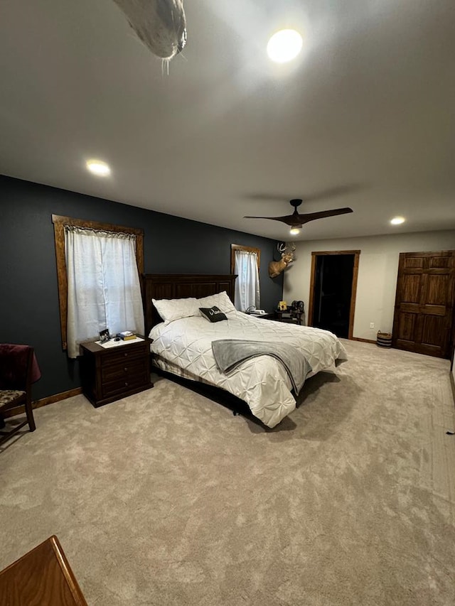 carpeted bedroom with ceiling fan