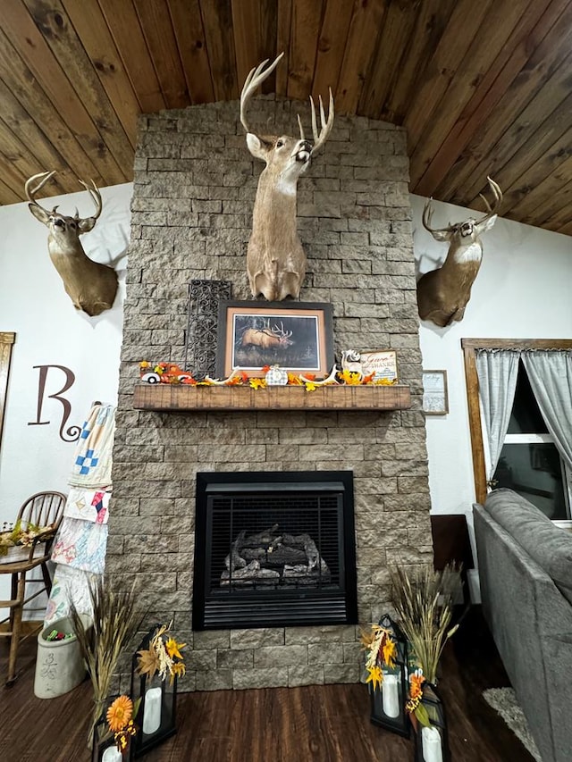 room details with wood-type flooring, wood ceiling, and a fireplace