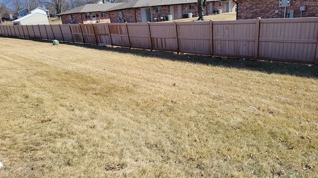 view of yard with fence and a residential view