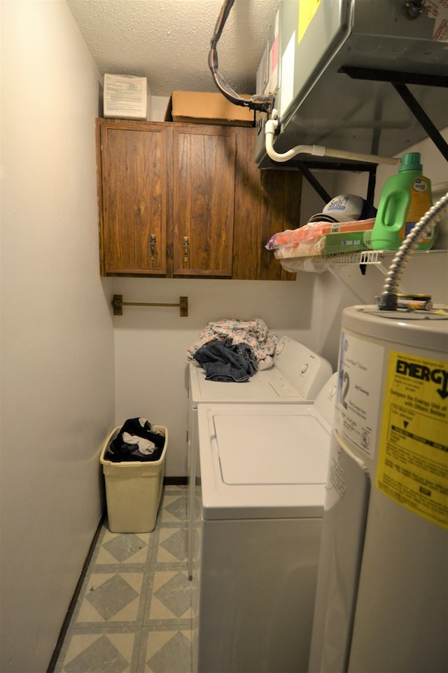 207 Woodwinds Ct, Kirksville, MO 63501 - laundry room with cabinet space, tile patterned floors, a textured ceiling, washer and dryer, and water heater
