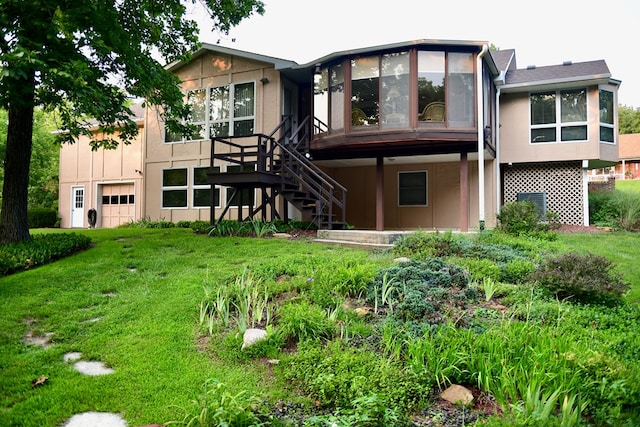 rear view of property featuring a yard