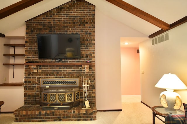 carpeted living room with vaulted ceiling with beams