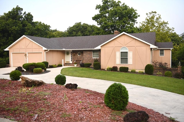 ranch-style house with a garage and a front lawn